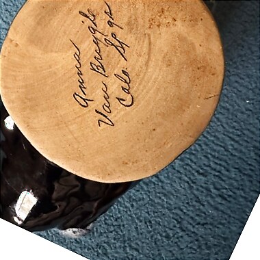 Hand-incised 'Anna Van Briggle Colo. Spgs' signature on the buff clay base of a high-gloss leaf dish