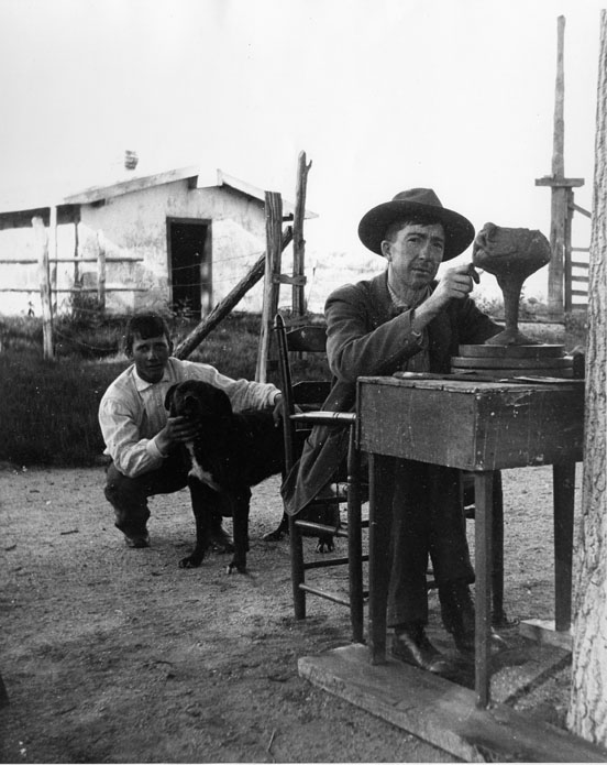 Artus Van Briggle at Chico Basin Ranch, circa 1900, modeling the Toast Cup