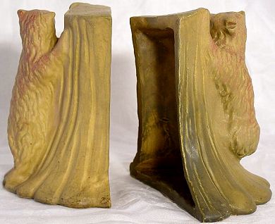 Van Briggle bear bookends, 1922-1926, mustard yellow with mulberry overspray