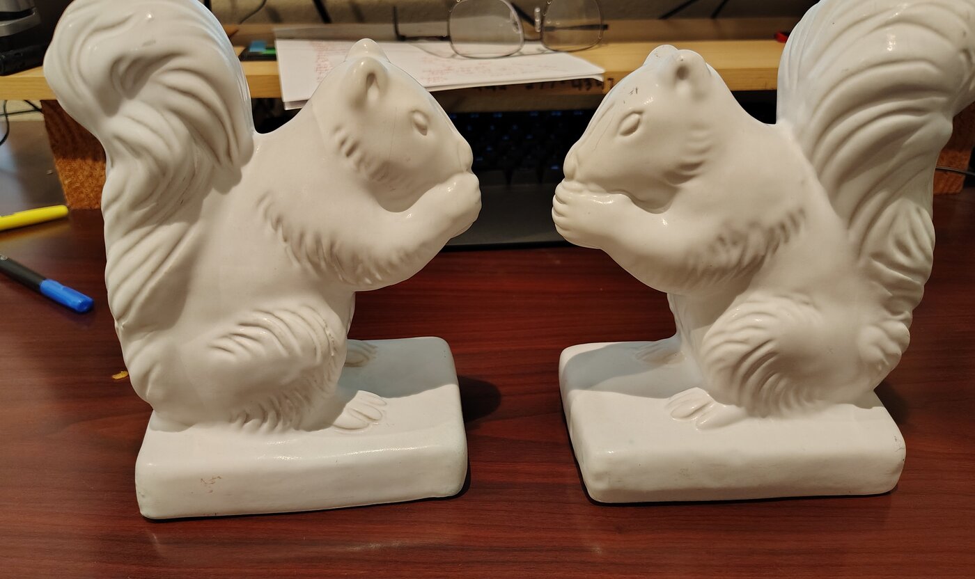 Pair of Van Briggle squirrel bookends in glossy white Moonglo glaze